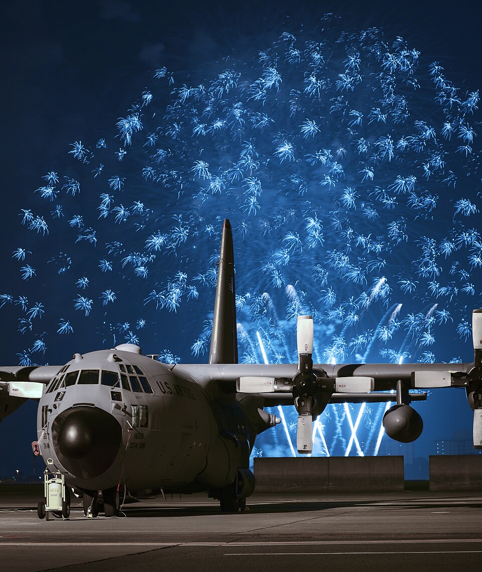 File:Fireworks explode behind a C-130 Hercules at Yokota Air Base, Japan (1).jpg